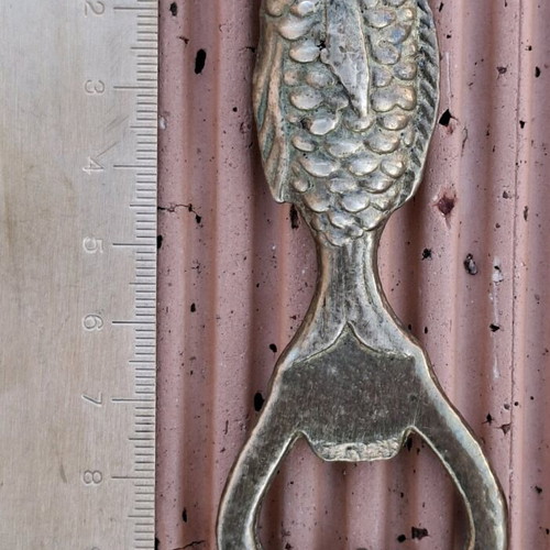 Vintage brass fish-shaped bottle opener used