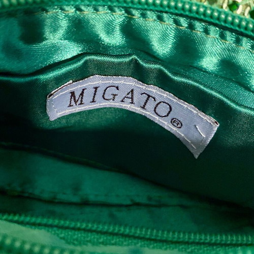 Migato green hand bag like new, satin interior