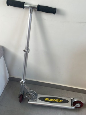 Scooter used with adjustable handlebar height and rear wheel brake