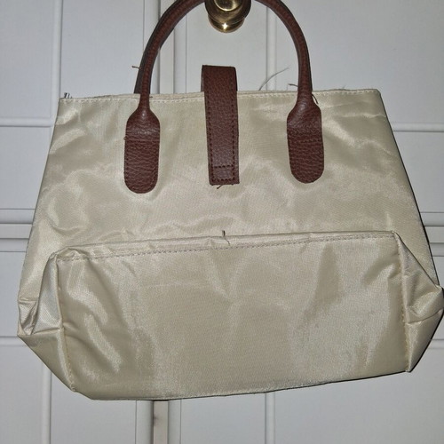 Handbag like new, small beige with brown leather handles and clasp