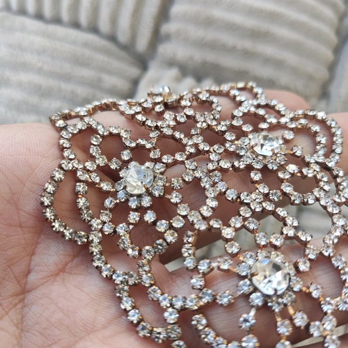 Evening bracelet with rhinestone flower motif like new, gold color