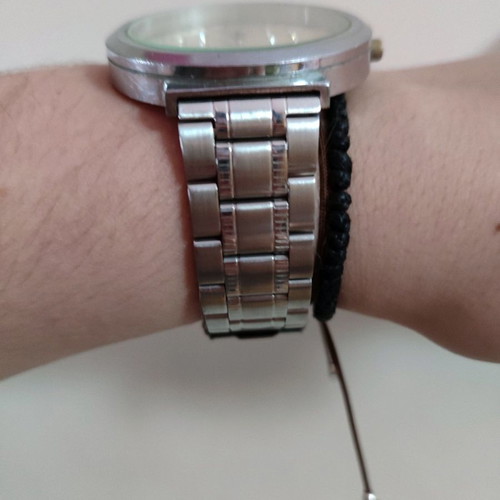 Wristwatch used with silver bracelet and rhinestone design