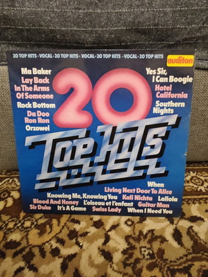 Vinyl record used with popular hits of the era