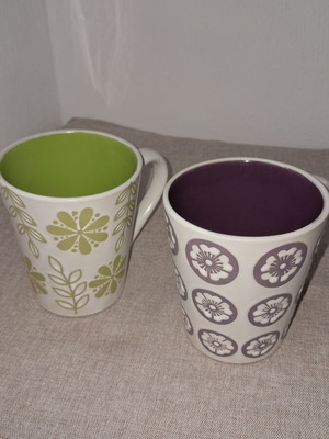 Mugs set of 2 with embossed designs, like new, purple and green