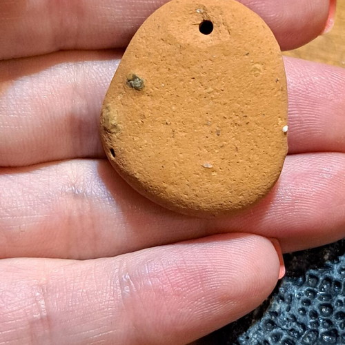 Natural raw stones like new, oval terracotta and textured gray