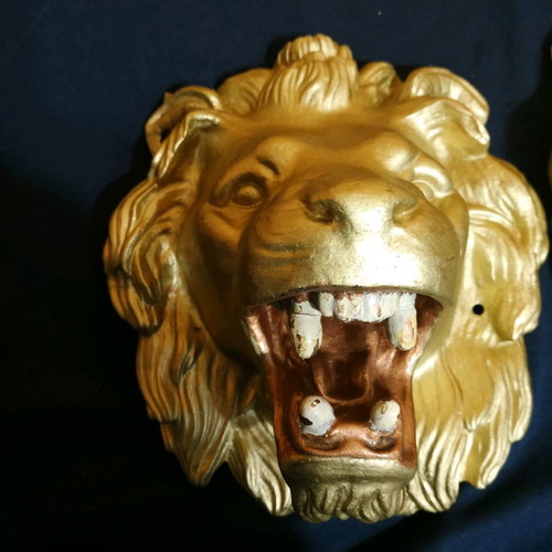 Decorative items used, cast iron lion heads, old antiques