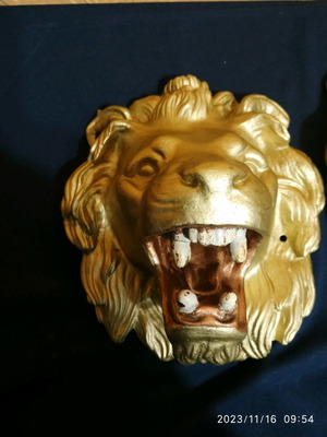 Decorative items used, cast iron lion heads, old antiques