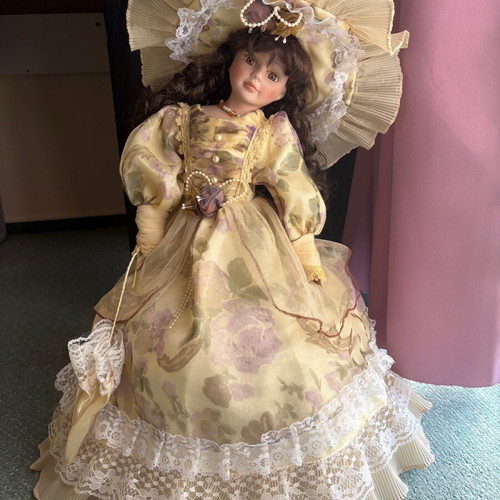 Porcelain doll like new with hat and umbrella