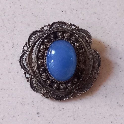 Filigree pin used, vintage 1950s–60s design