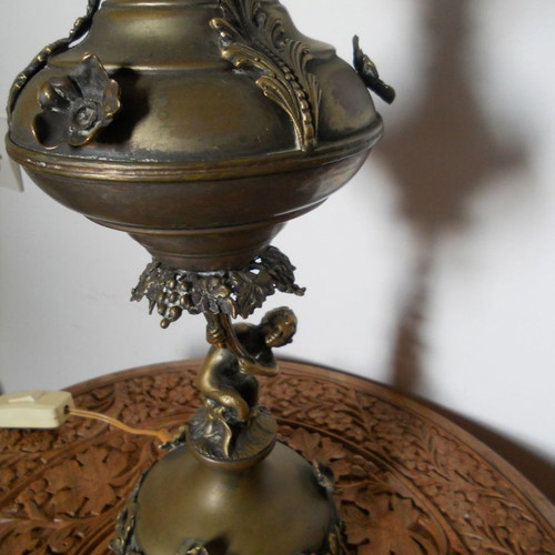 Bronze table lamp with putto used, authentic antique
