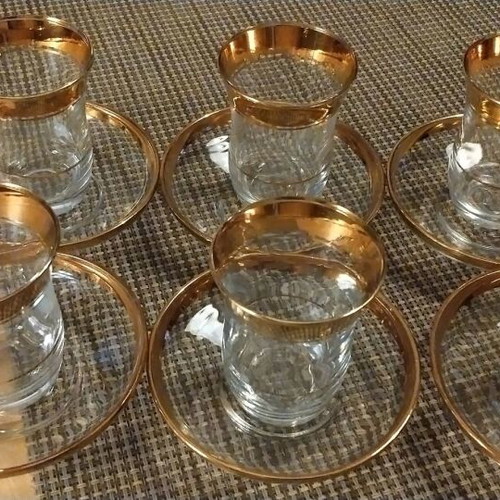 Glasses with Saucers like new with Gold Decoration