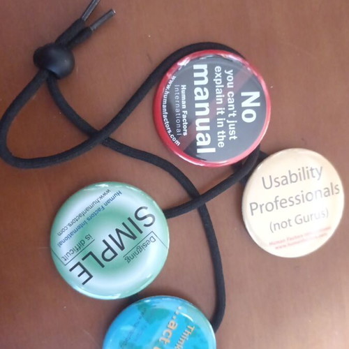 Large colorful pins set of 7 on safety cord, like new