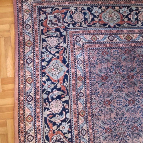 Handmade wool rug used, approximately 10 sqm