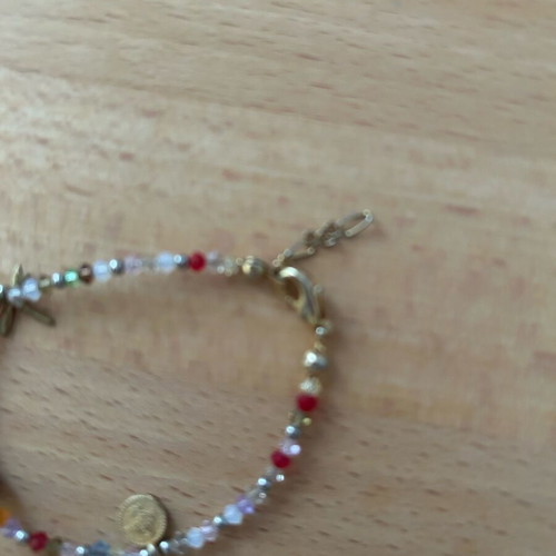 Thin bracelet with colorful stones and charms like new