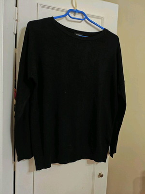 Black pullover used with round neckline, loose fit