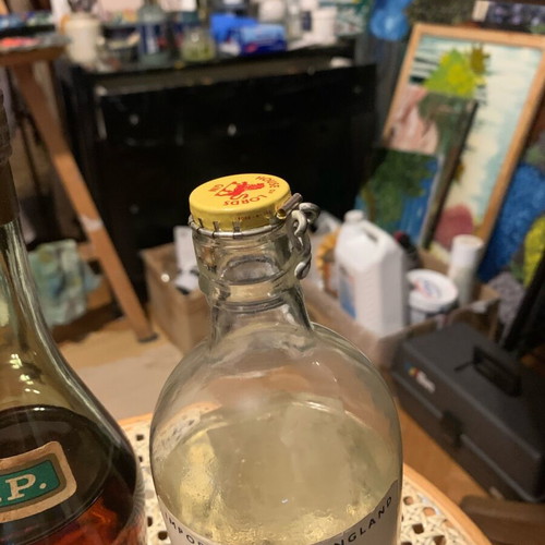 Hennessy cognac 1950 and gin 1960 bottles unopened