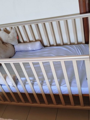 Baby items set like new with cot, changing table, and high chair