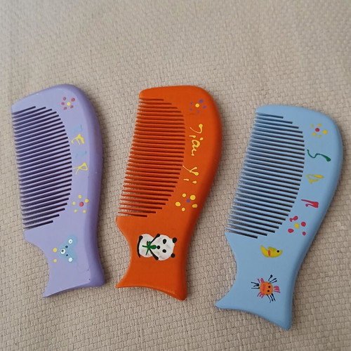 Wooden combs with handmade painted designs