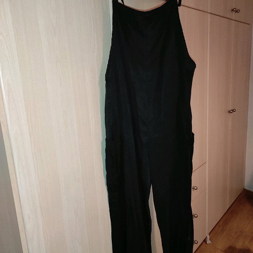 One-piece jumpsuit used, black with side pockets