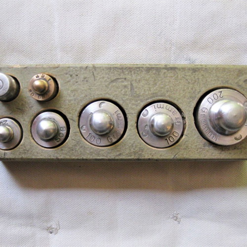 Set of old brass weights used with case