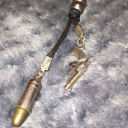 Jewelry pistol and bullet like new, black and silver
