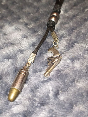 Jewelry pistol and bullet like new, black and silver