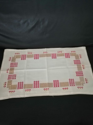 Handmade woven table runner with geometric patterns, like new