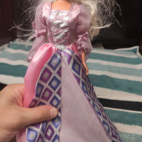 Doll with beautiful dress used