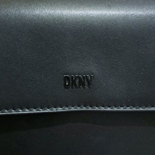 Dkny black leather crossbody bag like new with knot design strap