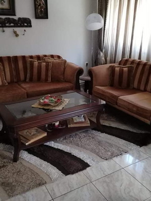 Two-seater and three-seater sofa set used with wooden armrests