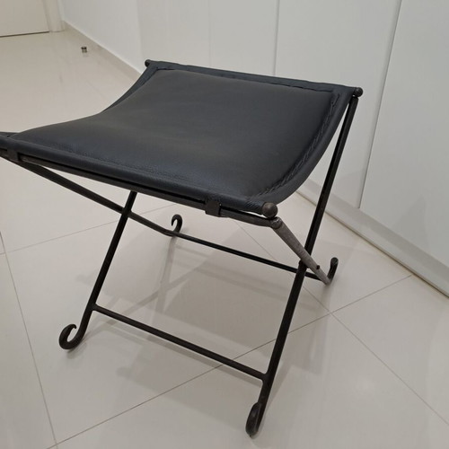 Leather footstool like new, black with cast iron frame