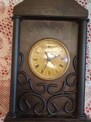 Vintage decorative tabletop clock with wooden and wrought iron details