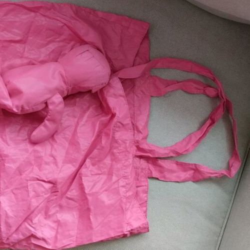 Fuchsia shoulder bag used for shopping with teddy bear pouch