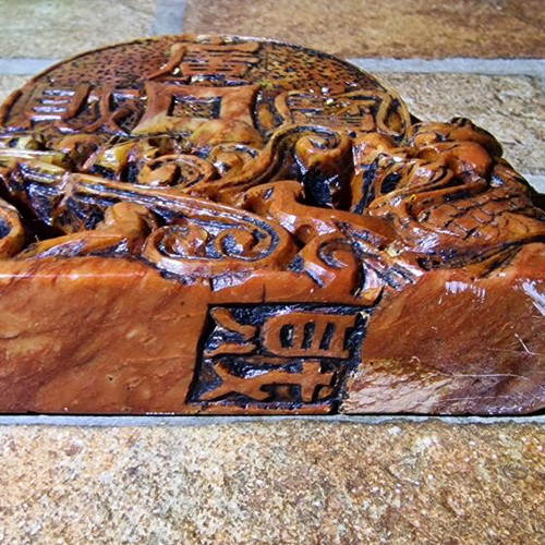 Stone carved sculpture used with dragons and coin