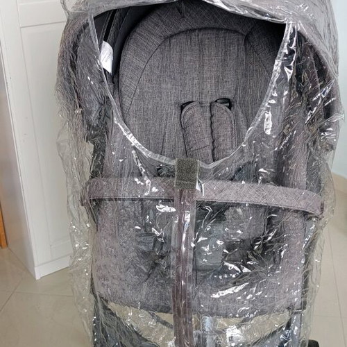Stokke Xplory stroller used with mosquito net and rain cover