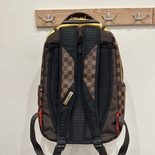 Sprayground That Gold Drip DLXSV Backpack new, black and brown checkered with gold design
