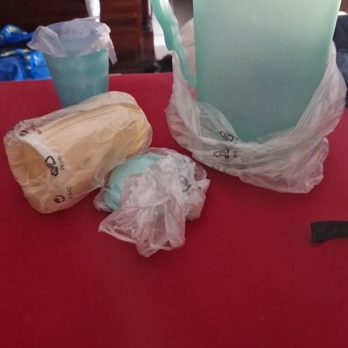 Tupperware pitcher with 4 glasses and lid new