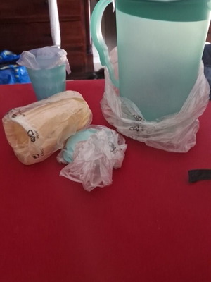 Tupperware pitcher with 4 glasses and lid new