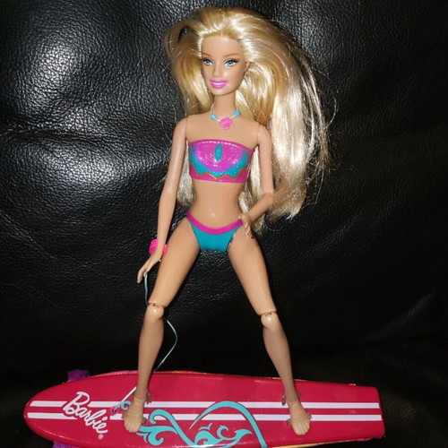 Barbie Merliah doll used with surfboard and mermaid tail