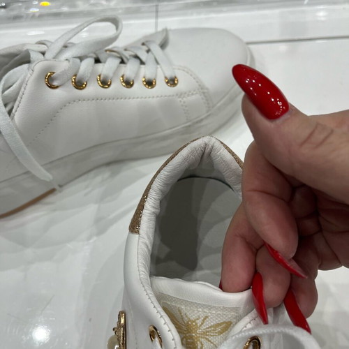 Women's athletic shoes used, white with gold details, size 39