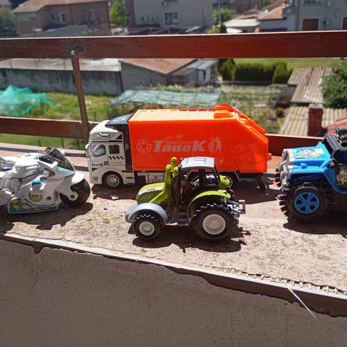 Lot of 4 used medium-sized children's toy vehicles