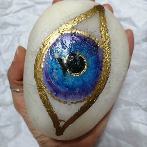 Candle in pebble shape with painted eye new