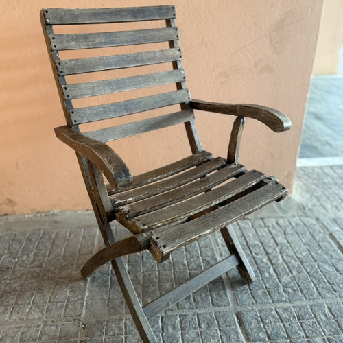 Wooden folding garden chair used with armrests