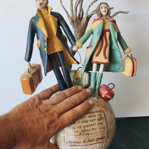 Handmade sculpture couple on globe by Nasia Soul