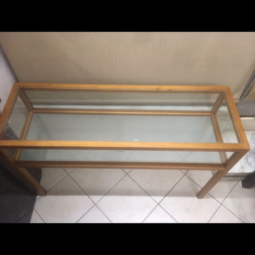 Console used with wooden frame and glass surfaces