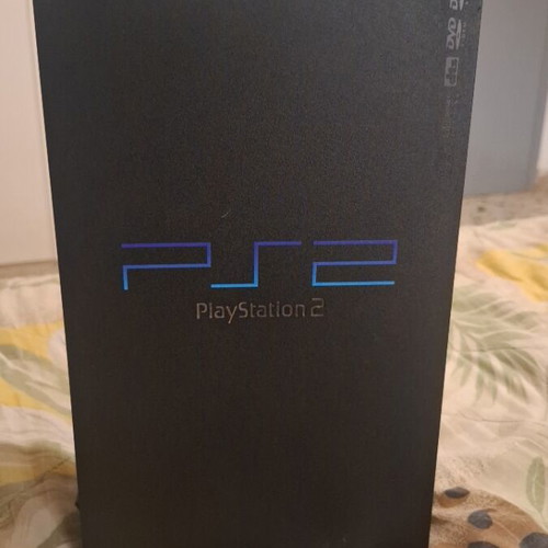 Sony PlayStation 2 console with 2 controllers, memory card and 5 games