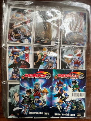 Beyblade cards and metal tags in album case like new