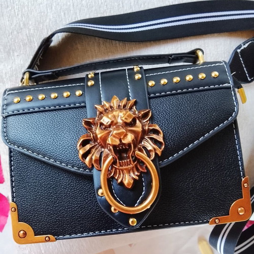 Black shoulder bag with lion design and rose gold details new