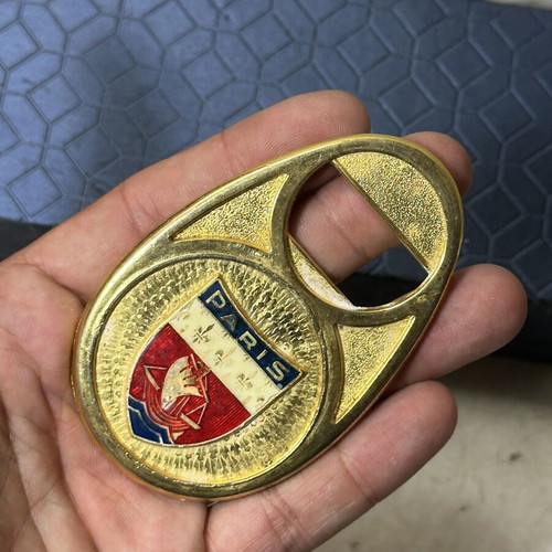 Vintage metal bottle opener Paris with embossed city crest, used