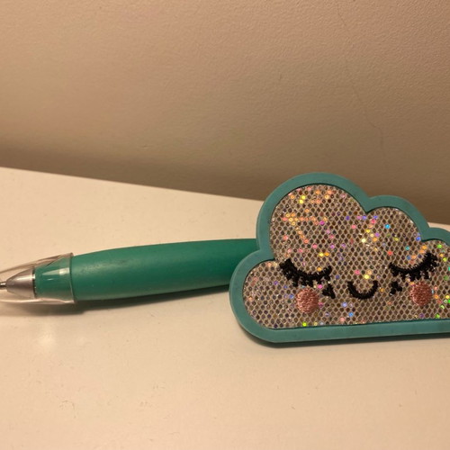 Pen used with cloud design in blue color